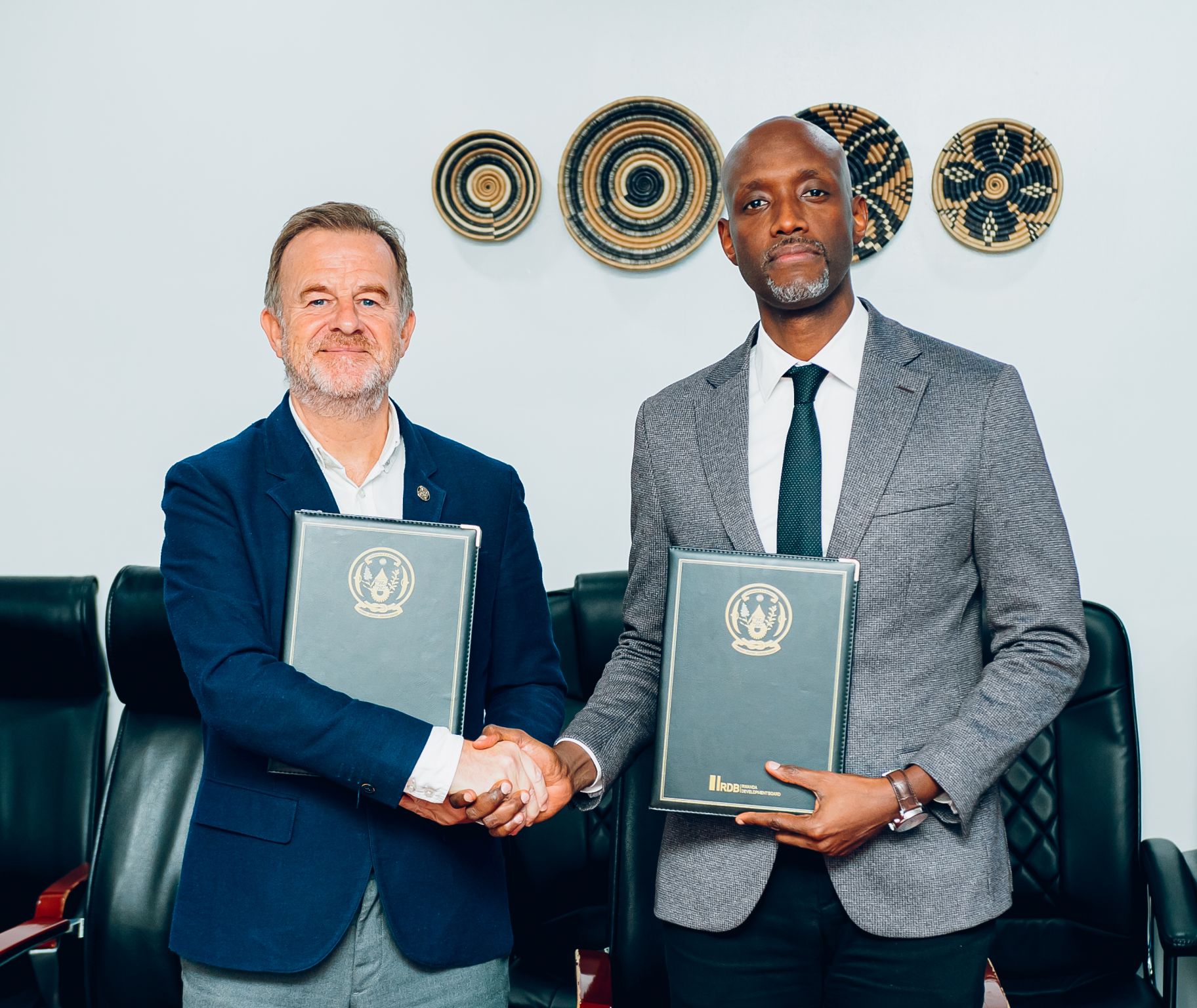 Derek Stewart and RDB CEO Jean-Guy K. Afrika at the MoU signing, Kigali, June 2026